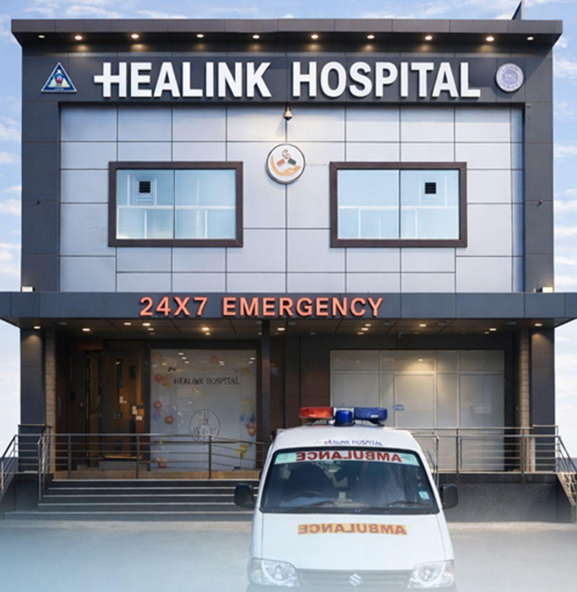 Healink Hospital building entrance with 24×7 emergency signage, Faridabad